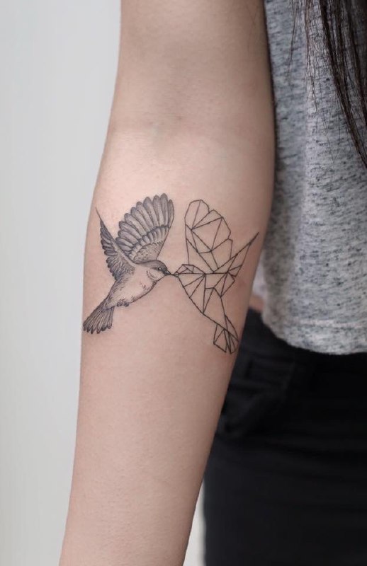 Large tattoo of two sparrows on the forearm for women