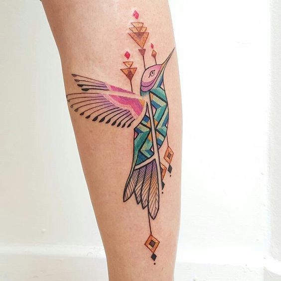 Colored hummingbird tattoo on the calf for women