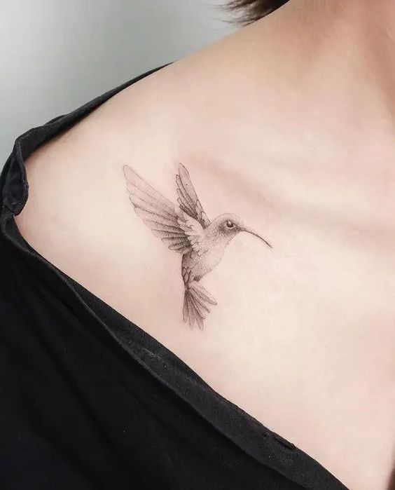 Hummingbird tattoo on the collarbone for women