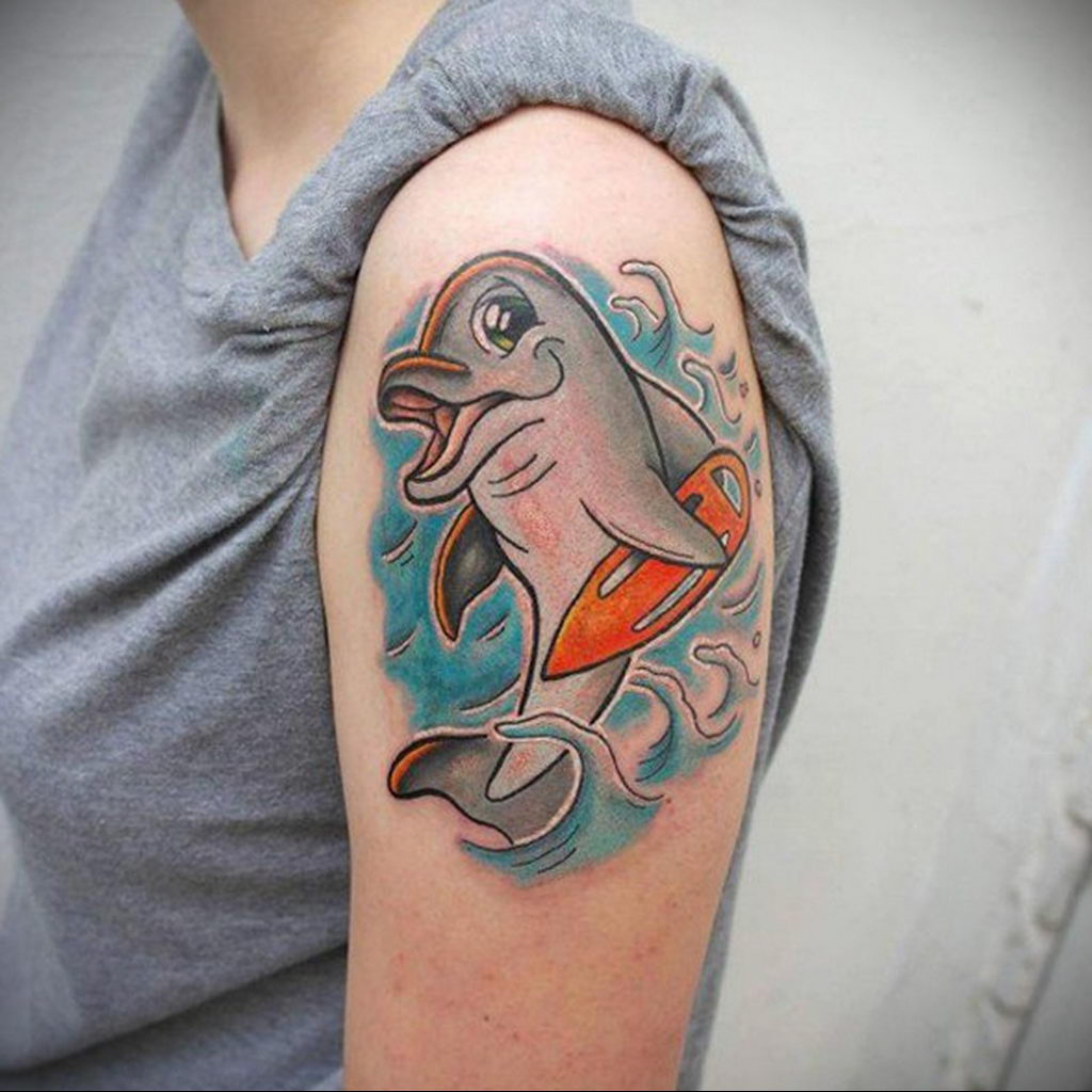 Colorful dolphin tattoo on the shoulder for women