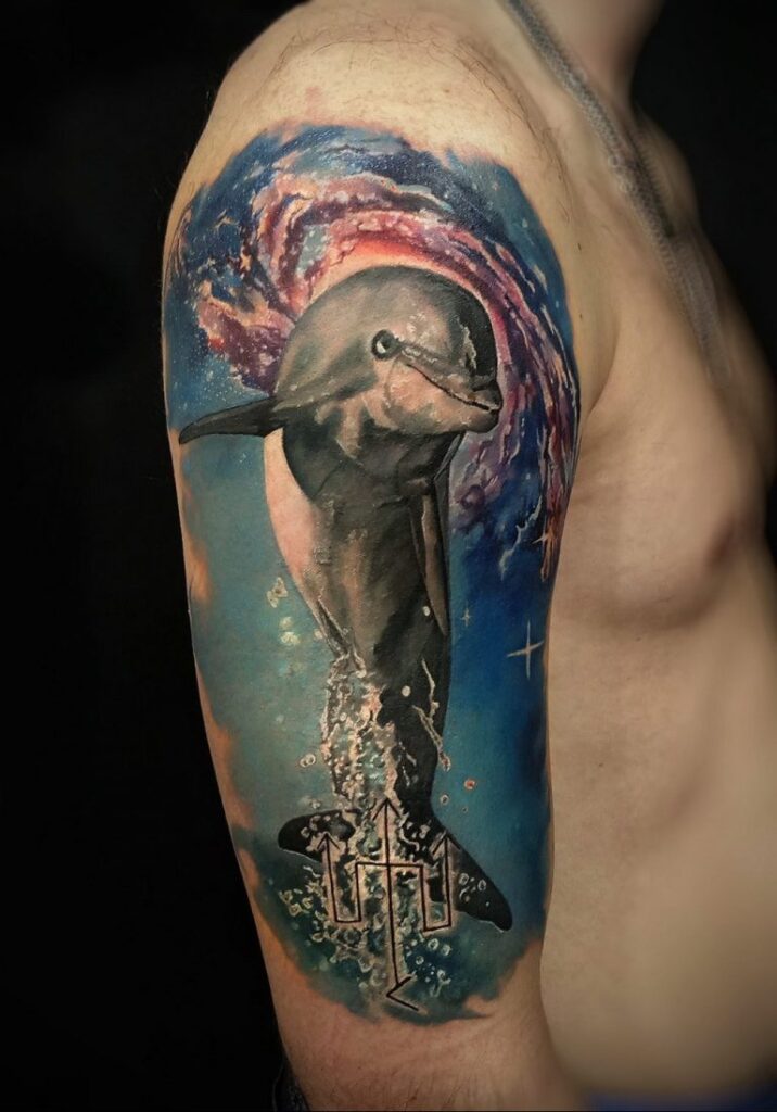 Large dolphin tattoo on the arm for men