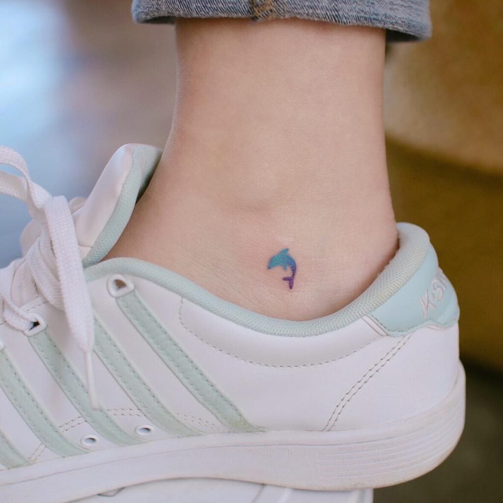 Small dolphin ankle tattoo for women