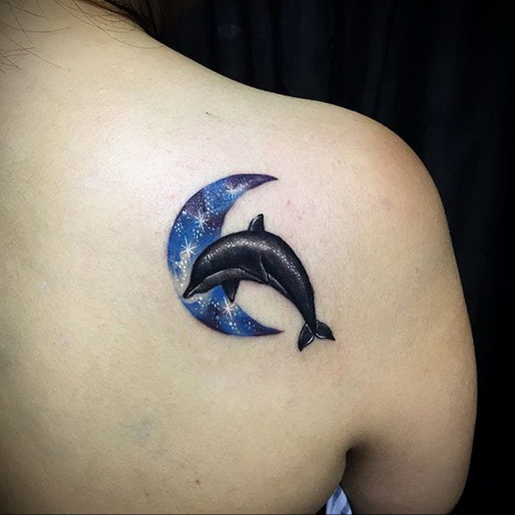 Colorful dolphin and moon tattoo on the shoulder blade for women