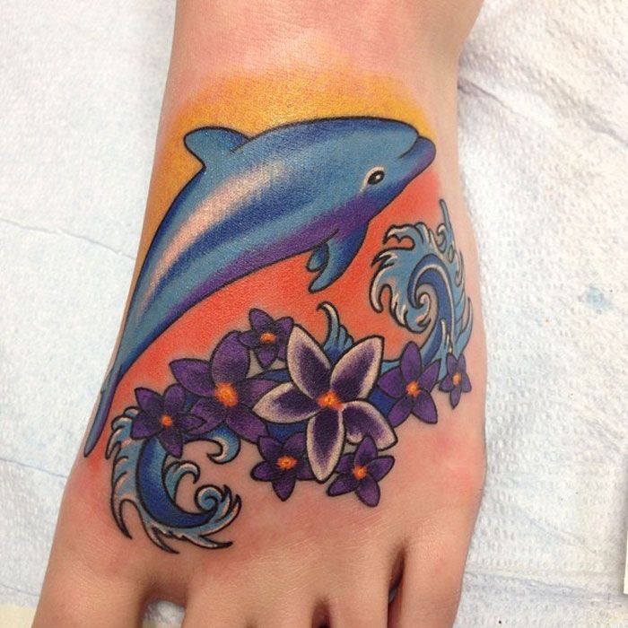 Colored ankle dolphin tattoo for women