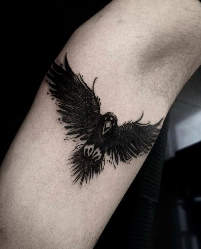 Tattoo of a raven on the forearm for men