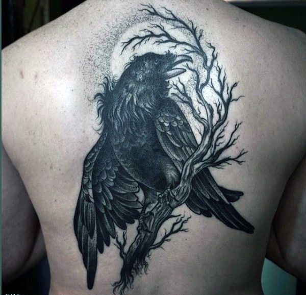 Large raven tattoo on the back for men