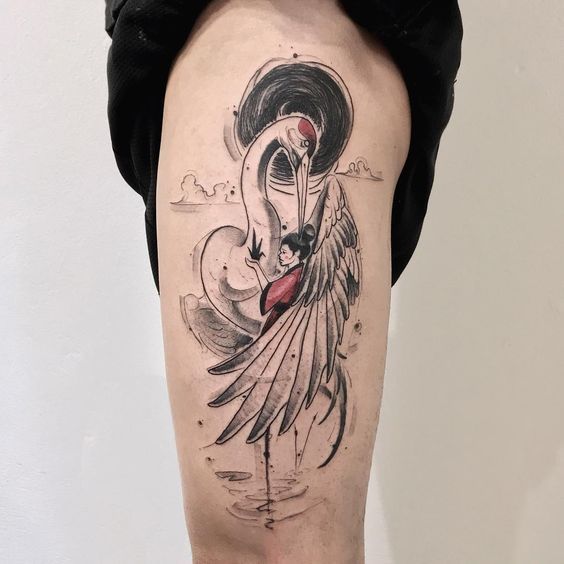 Large crane tattoo on the thigh for women