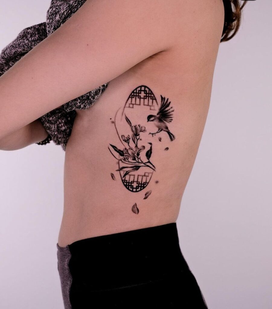 Bird tattoo on the side for women