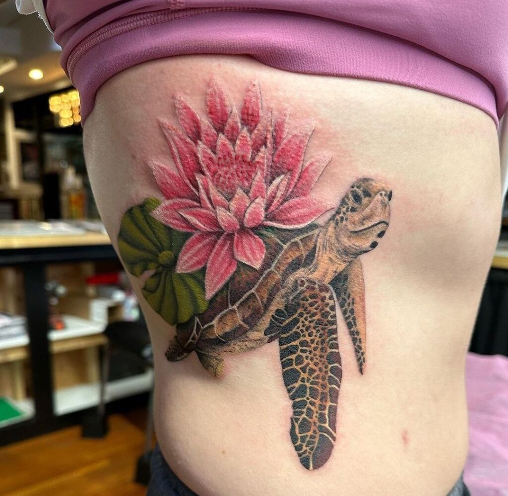 Colorful lotus and turtle tattoo on the side for women