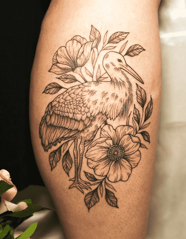 Stork tattoo with flowers on the arm for women