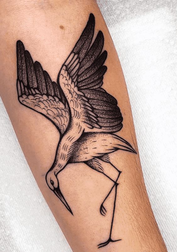 Stork tattoo on the arm for women