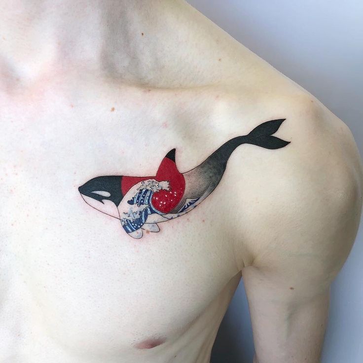 Colored orca tattoo on the chest for men