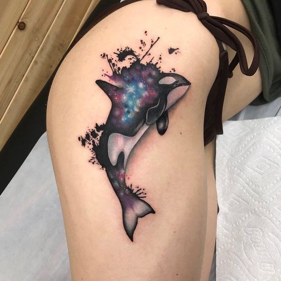 Large orca tattoo on the thigh for women