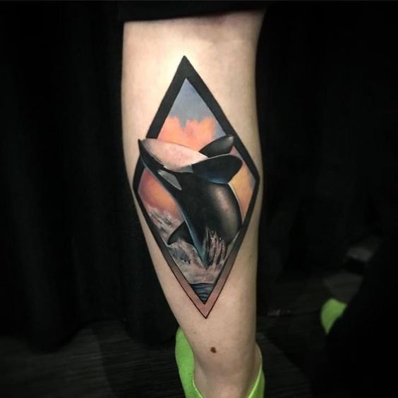 Colored orca tattoo on calf for men