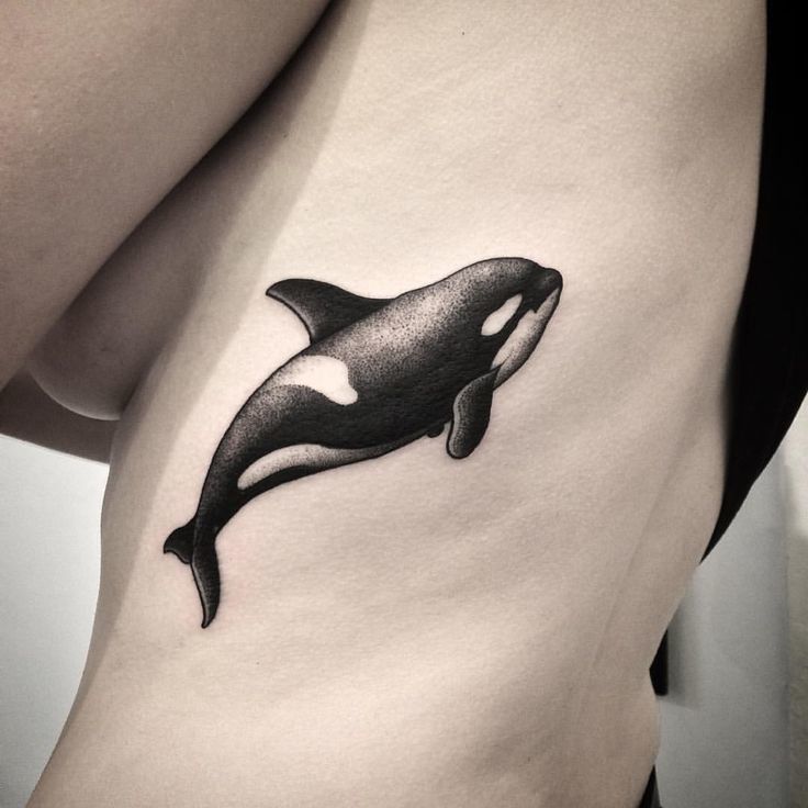 Large orca tattoo on the side for women