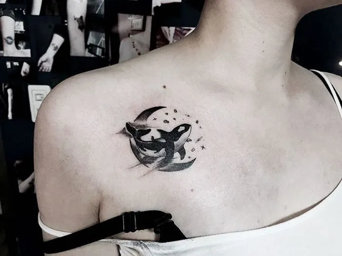 Orca tattoo on the collarbone for women