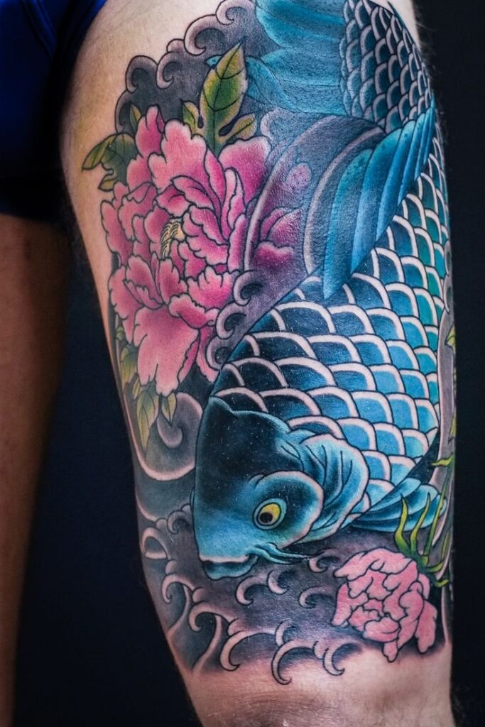 Large carp tattoo on the thigh for men