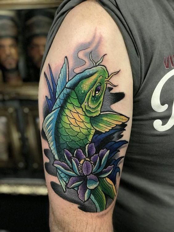 Color carp tattoo on the shoulder for men