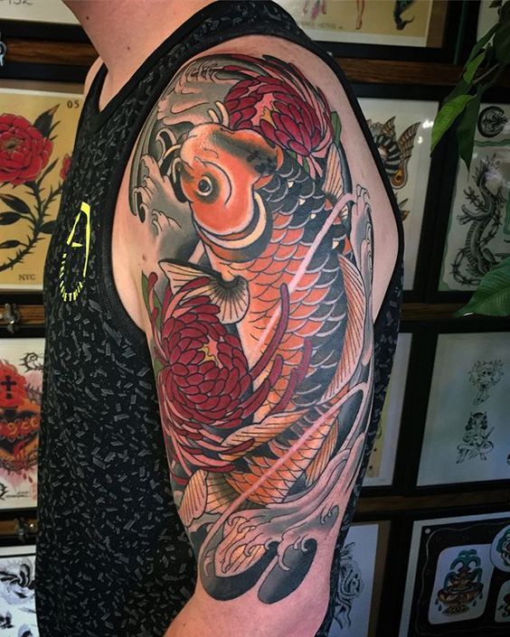 Color carp tattoo on the arm for men