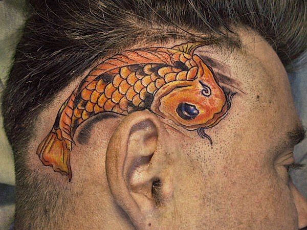 Color carp tattoo on the head for men