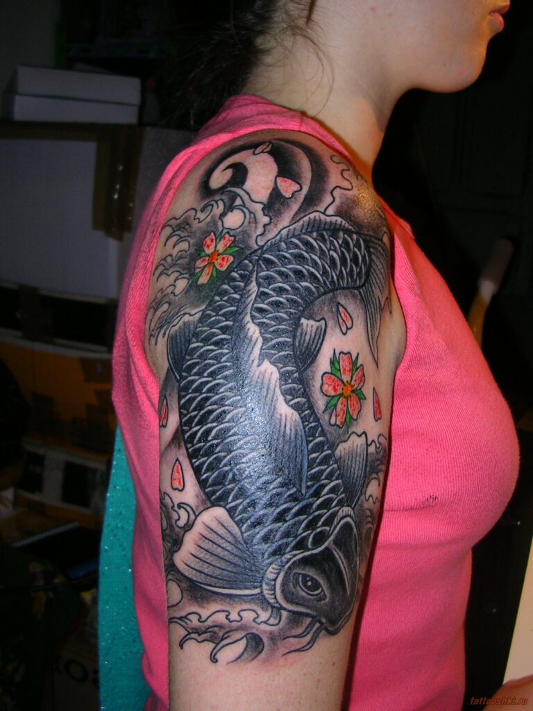 Large carp tattoo on the shoulder for women