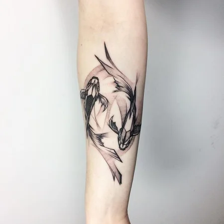 Tattoo of two carps on the forearm for men