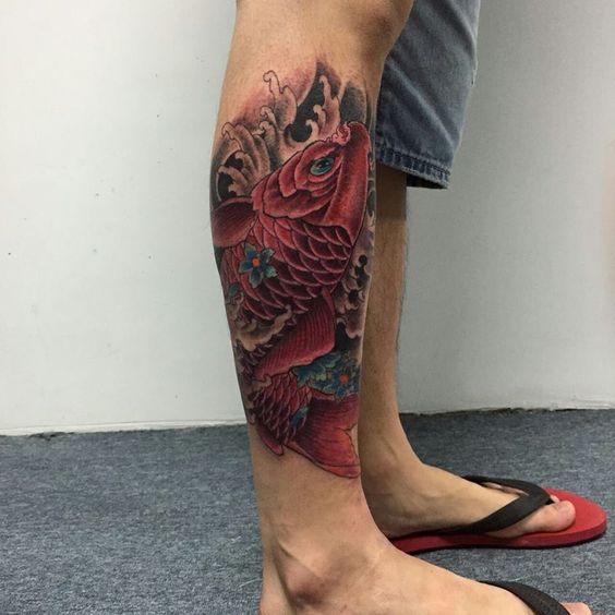 Large carp tattoo on the shin for men