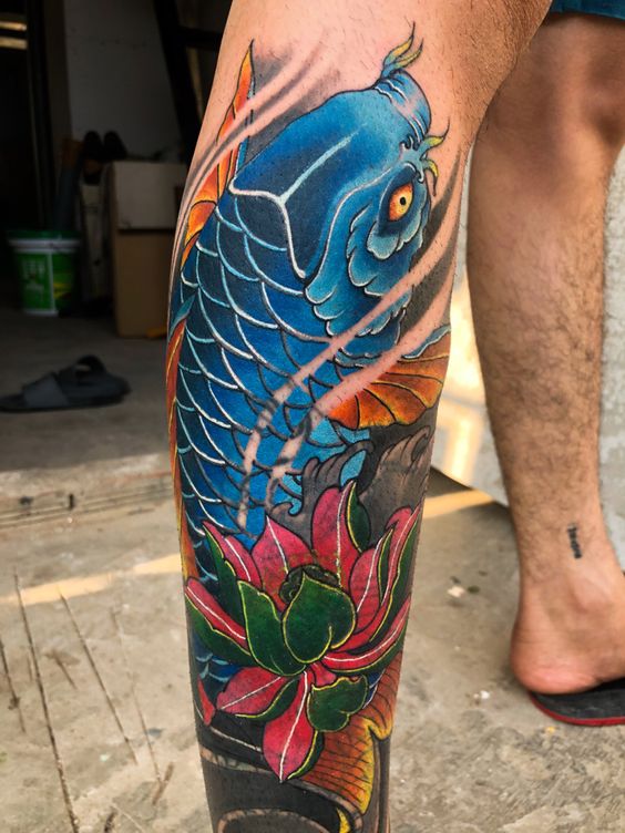 Color carp tattoo on the leg for men