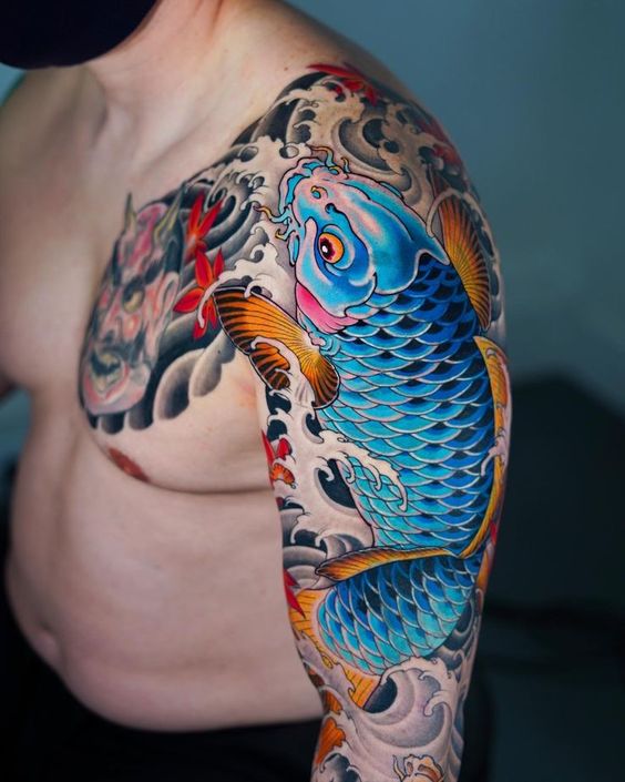 Color carp tattoo on the arm for men