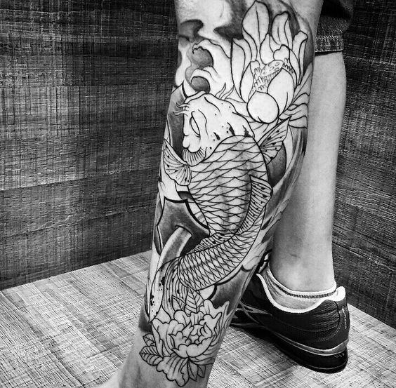 Large carp tattoo on the shin for men