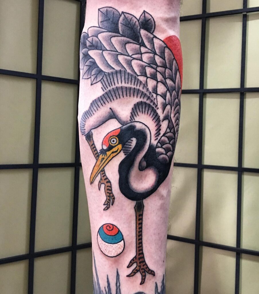 Large crane tattoo on the calf for men