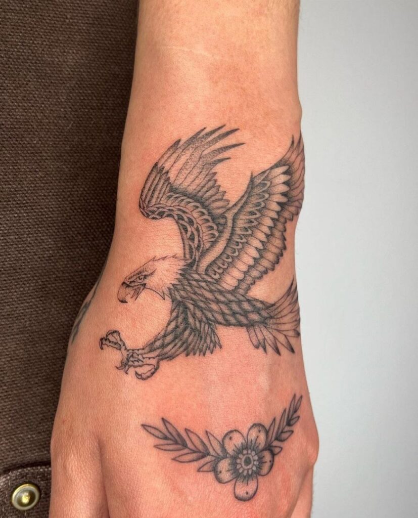 Tattoo of an eagle on the wrist for women