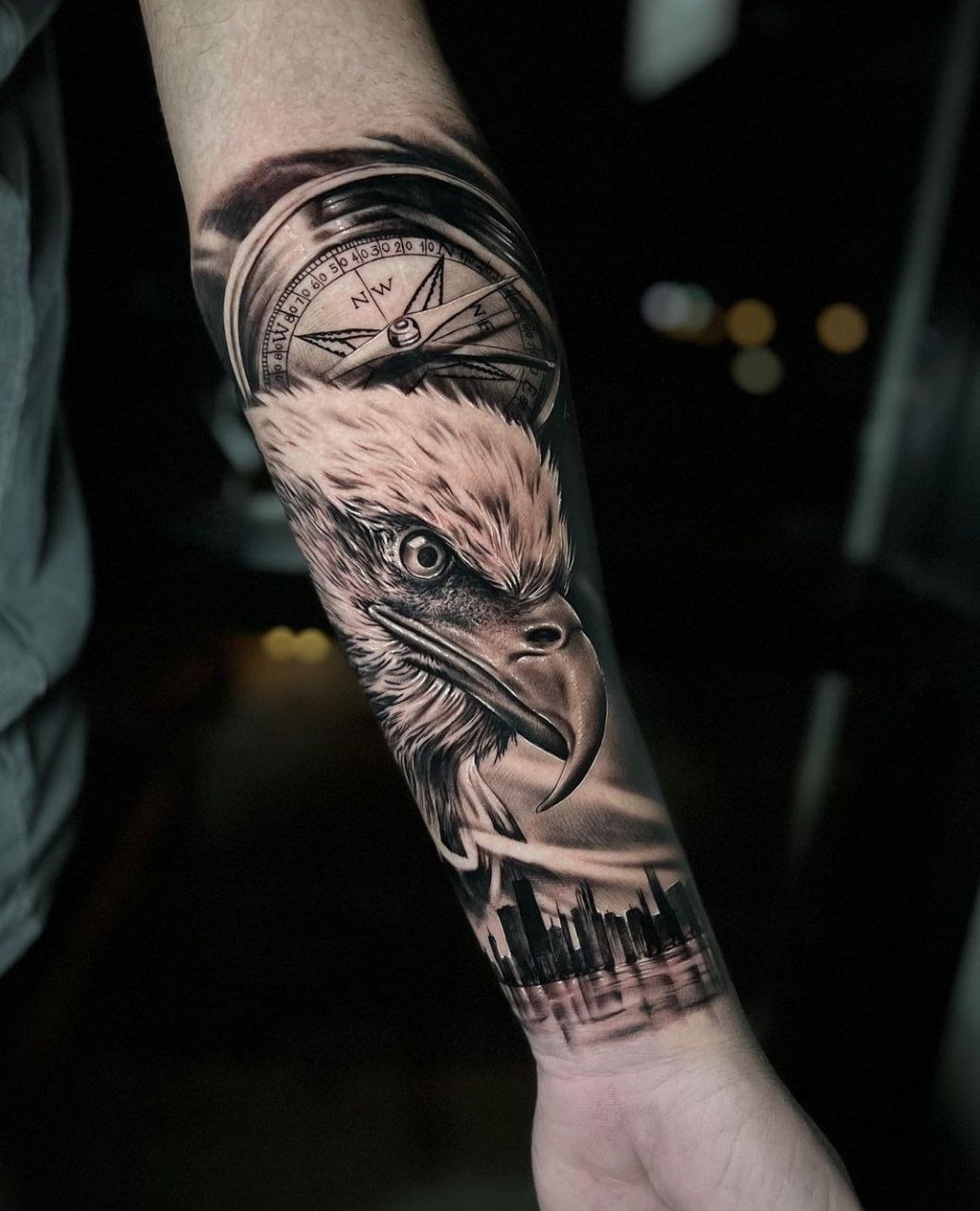 Large eagle and compass tattoo on the forearm for men