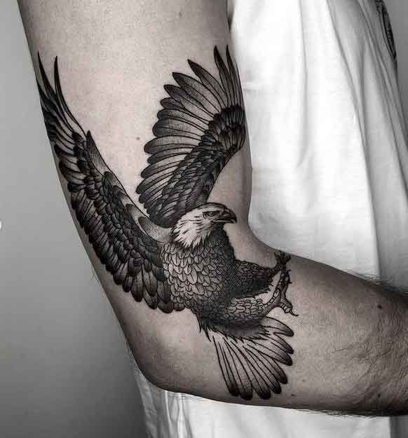 Large eagle tattoo on the arm for men