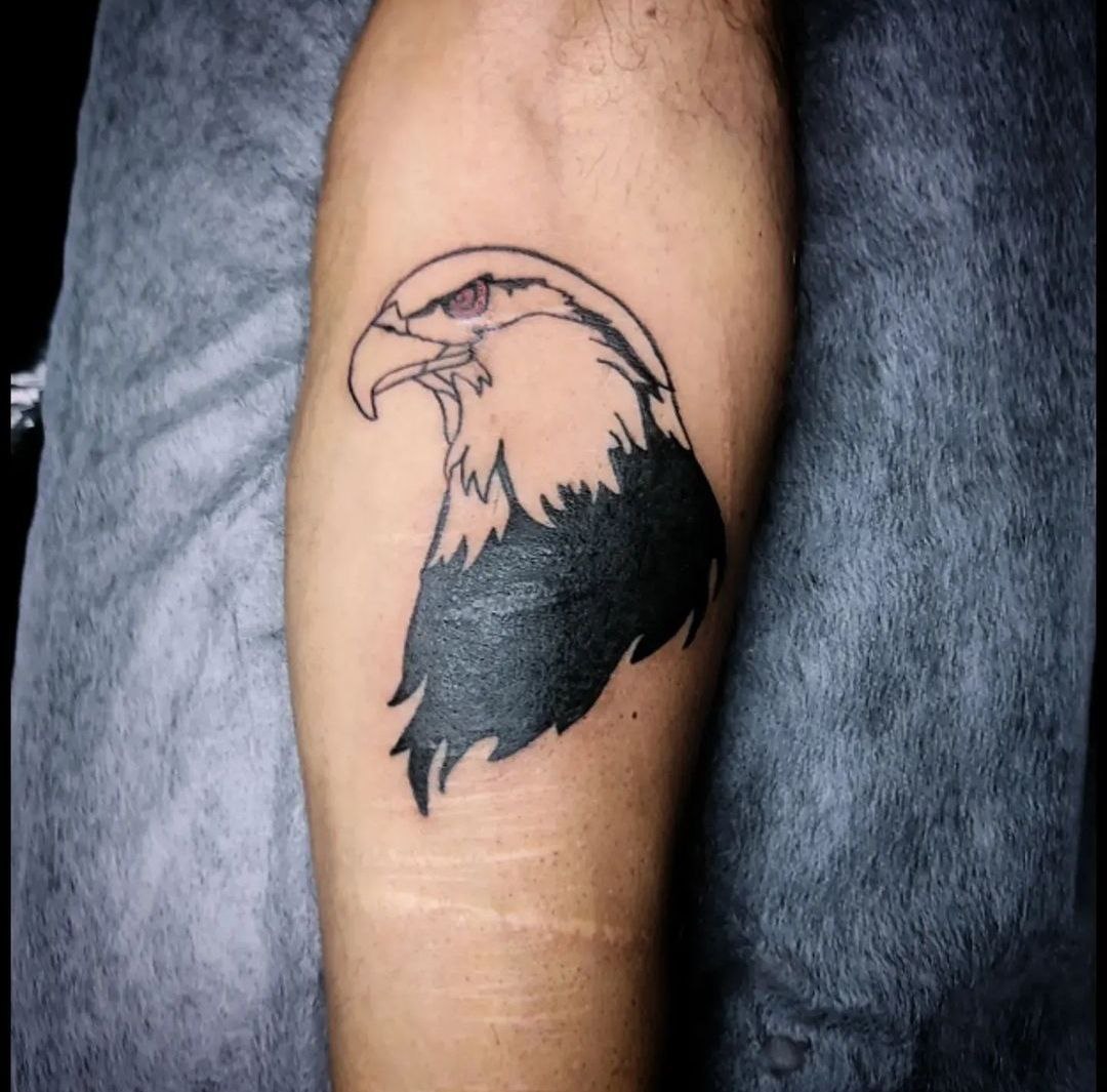 Large tattoo of an eagle on the forearm for men