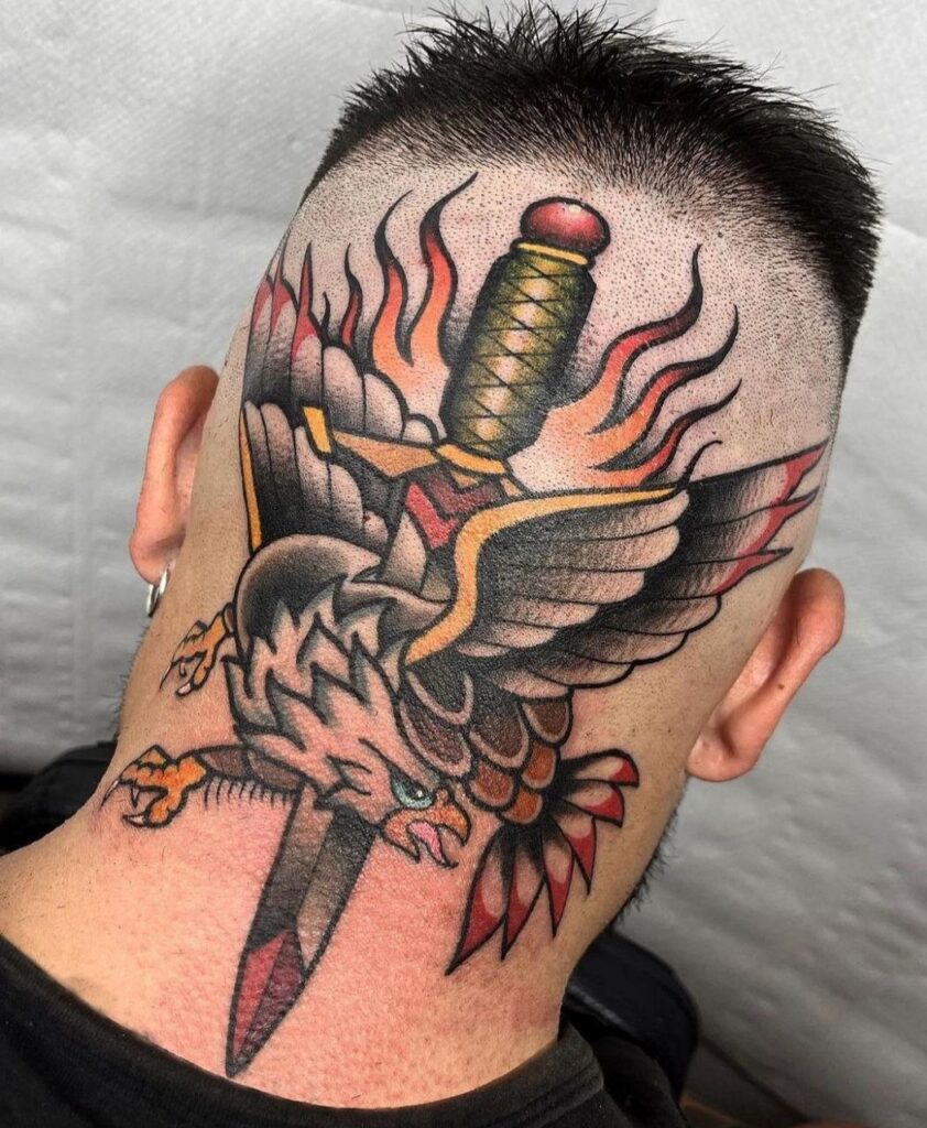 Color tattoo of an eagle with a dagger on the back of the head for men