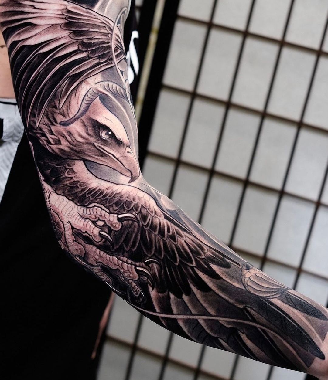 Large eagle tattoo on the arm for men