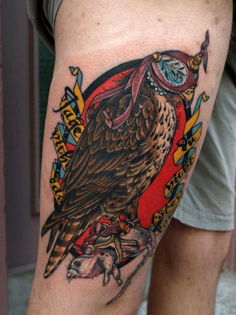 Color falcon tattoo with a target on the hip for men