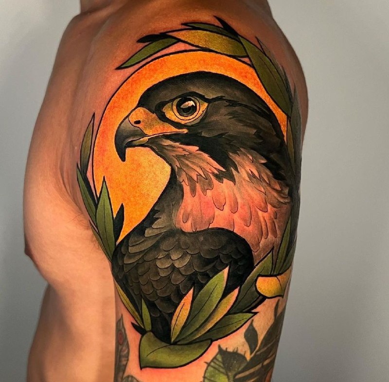 Color falcon tattoo on the shoulder for men