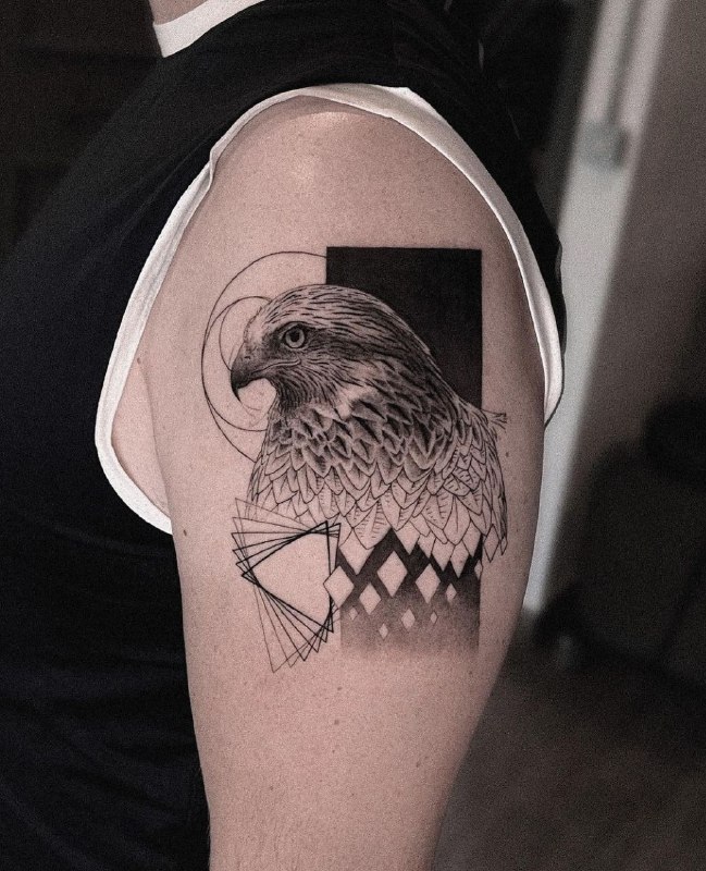 Large falcon tattoo on the shoulder for men