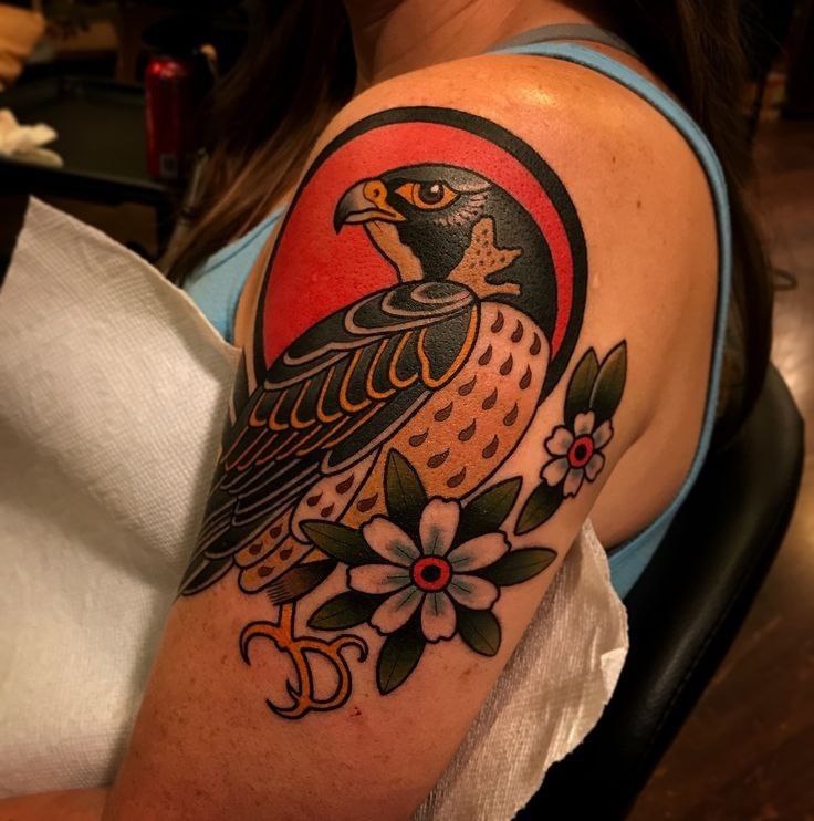 Color falcon and flowers tattoo on the shoulder for women