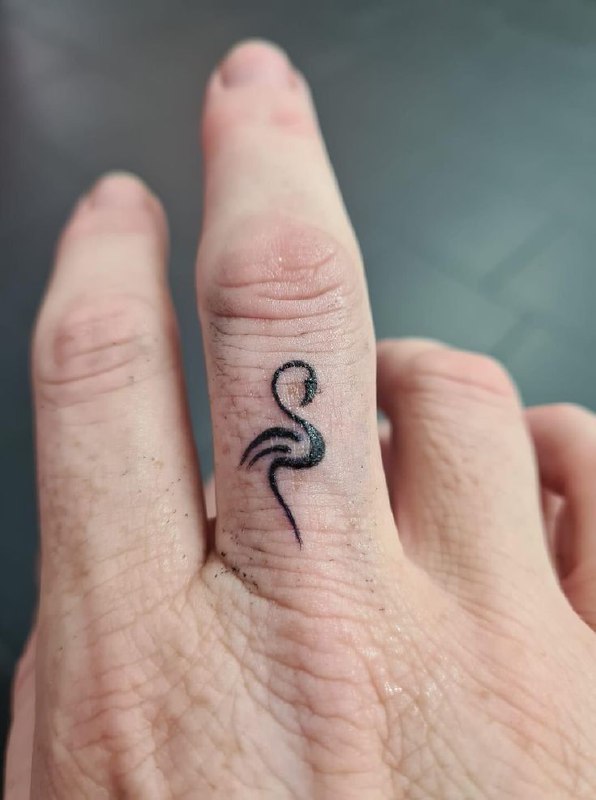 Small flamingo tattoo on the finger for women