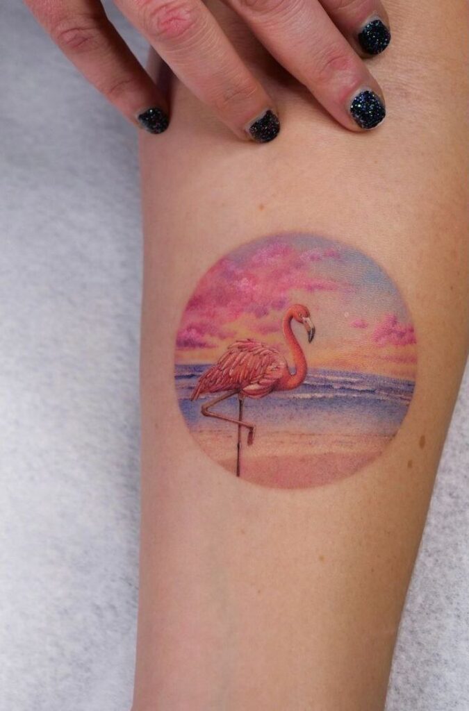 Color flamingo tattoo on the arm for women