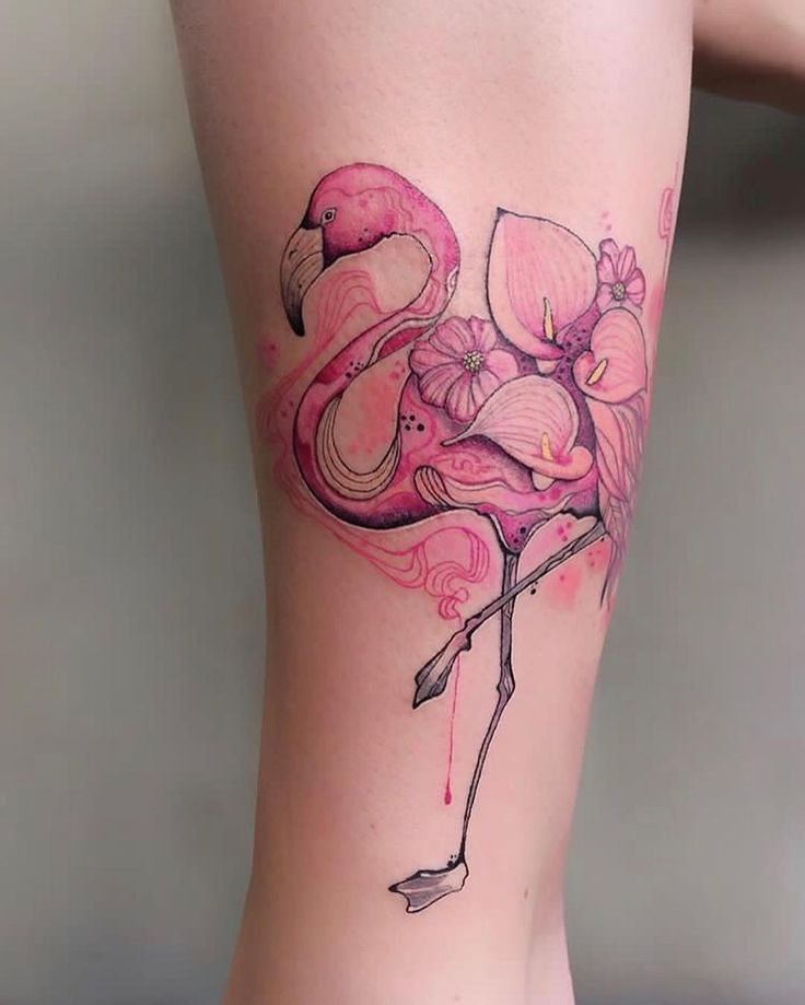 Large flamingo tattoo with flowers on the shin for women