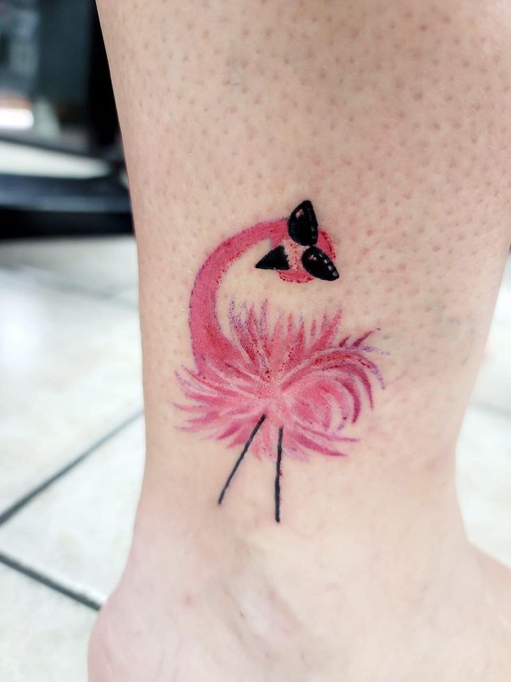 Color flamingo tattoo on the shin for women