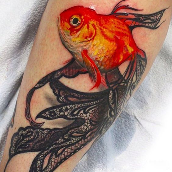 Large goldfish tattoo on the shin for women