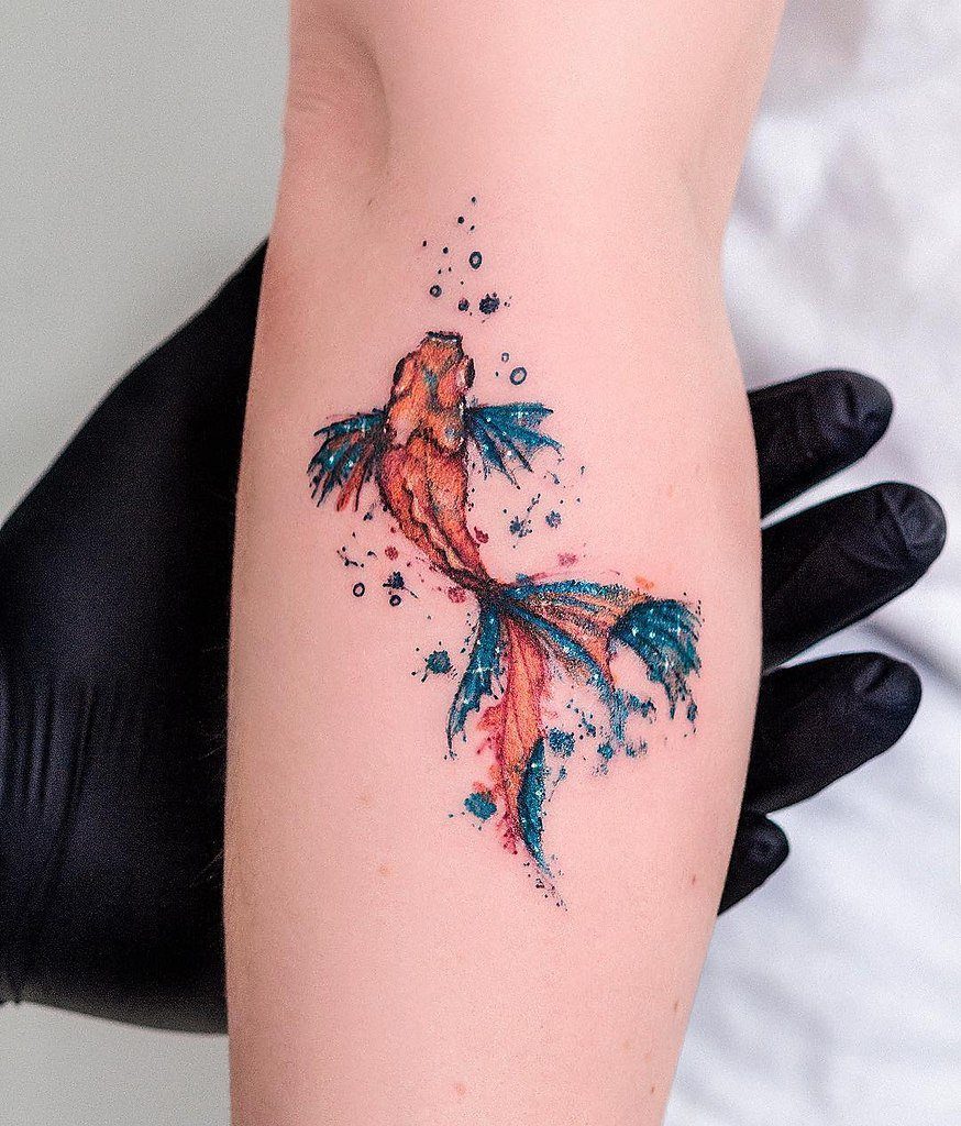 Goldfish tattoo on forearm for women