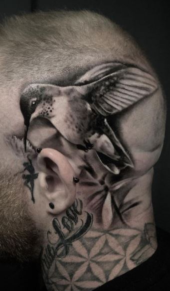 Large hummingbird tattoo on the head for men