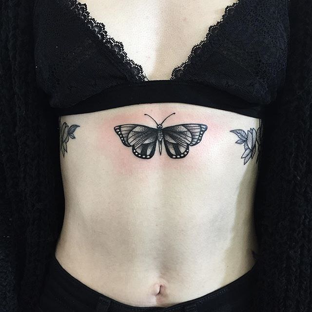 Butterfly tattoo on the stomach for women