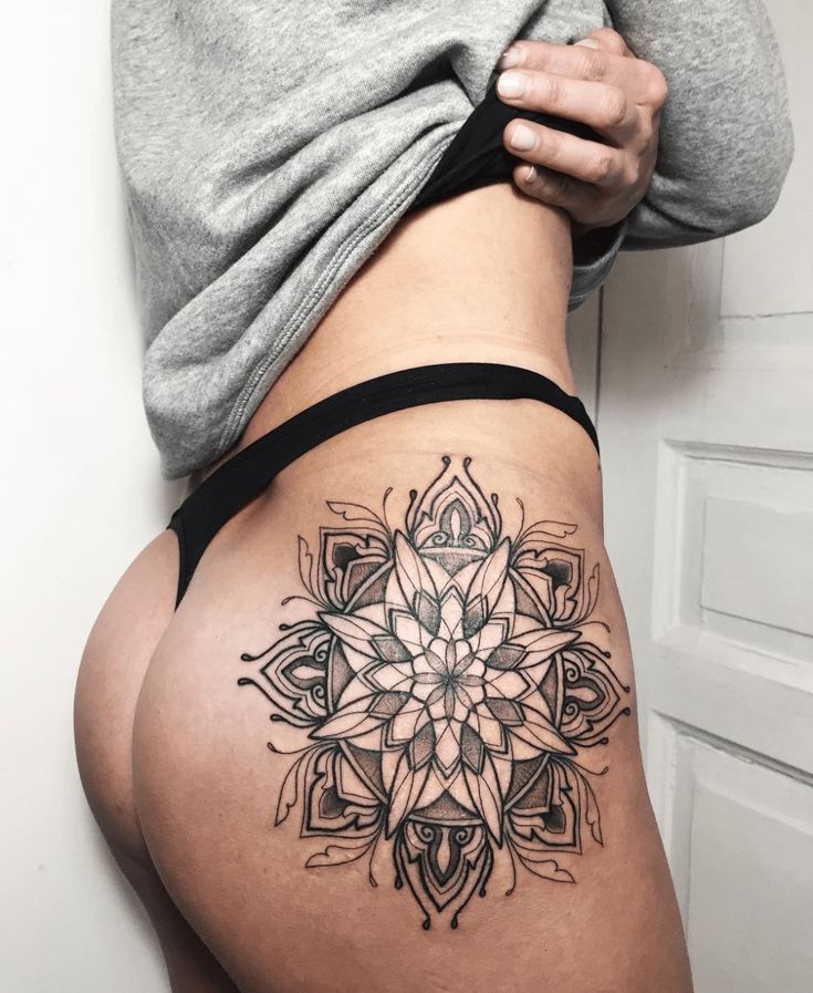 Large intimate flower tattoo for women